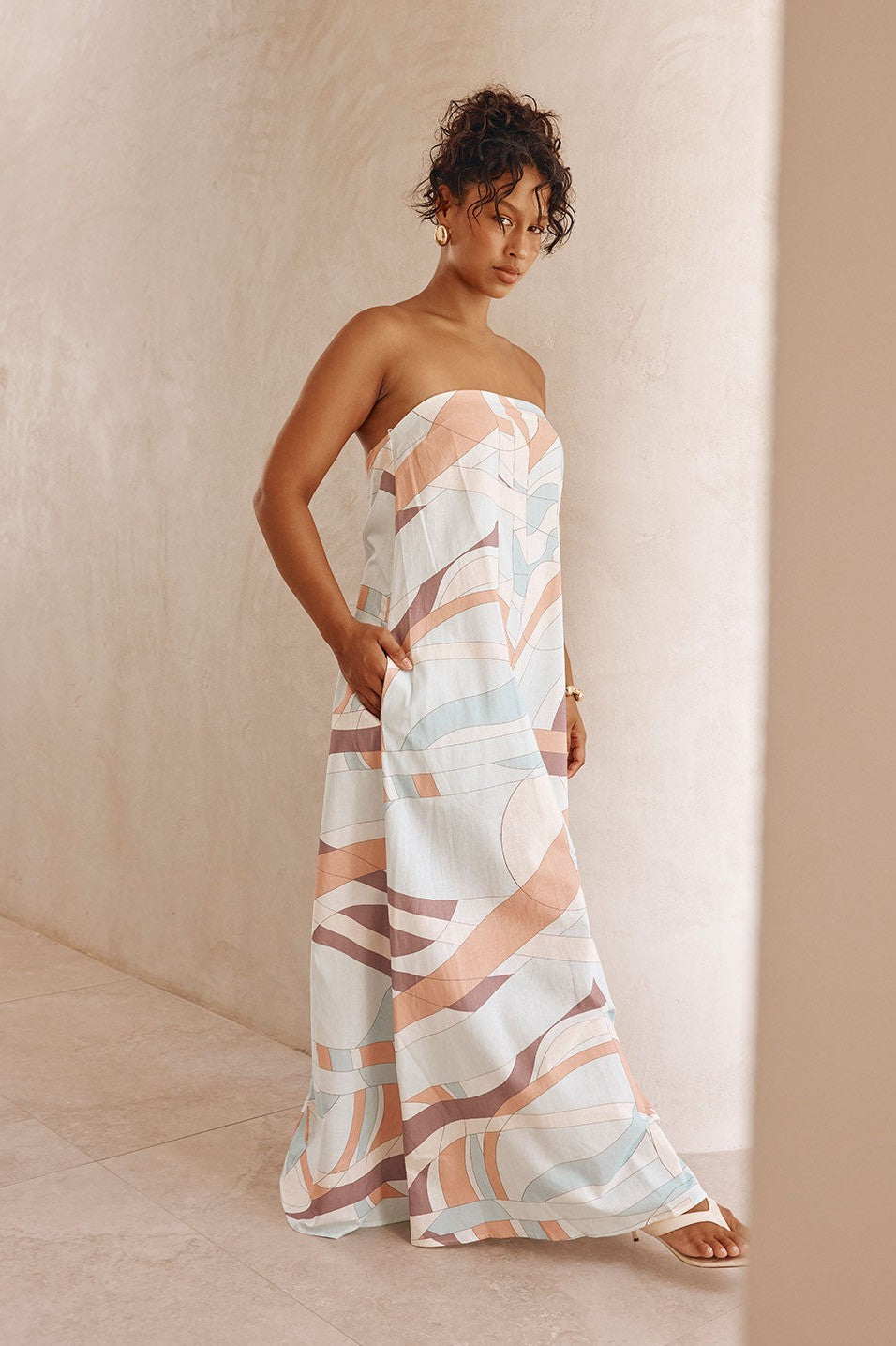 Blue maxi dress with a strapless neckline, back view
