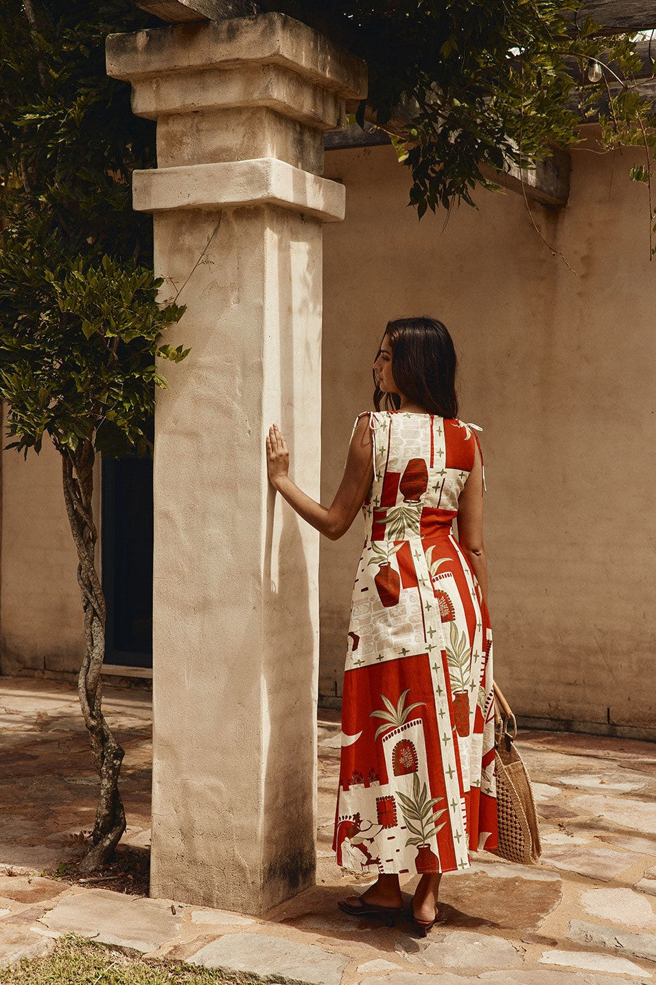 Red maxi dress with a V neckline, back view