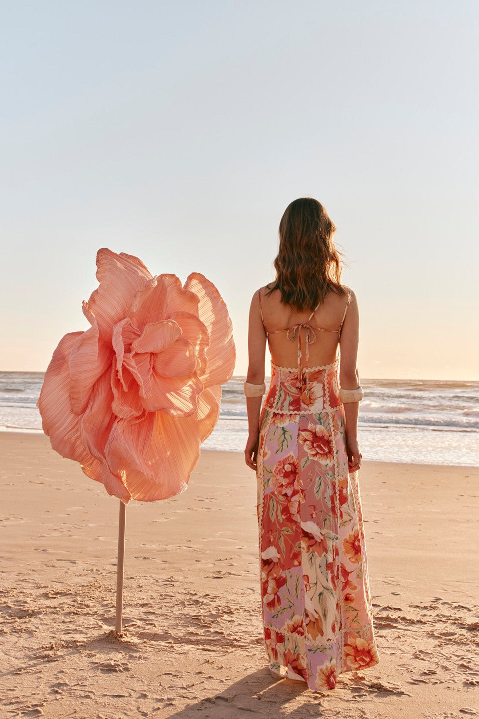 Pink maxi dress with an open back, front view