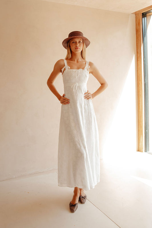 White maxi dress with an A-line skirt, front view