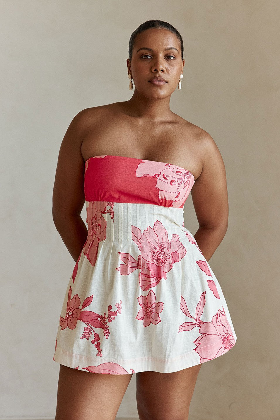 Pink mini dress with a strapless neckline, back view