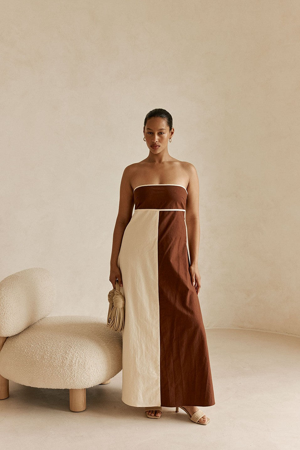 Cream maxi dress with a strapless neckline, back view