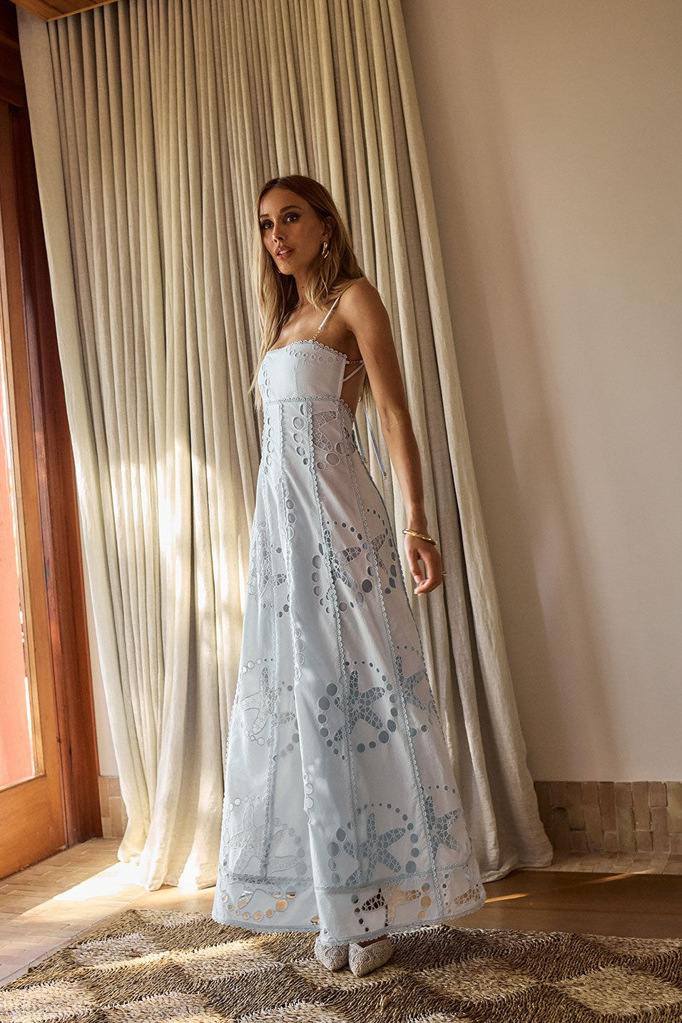 Blue maxi dress with a round neckline, styled on model