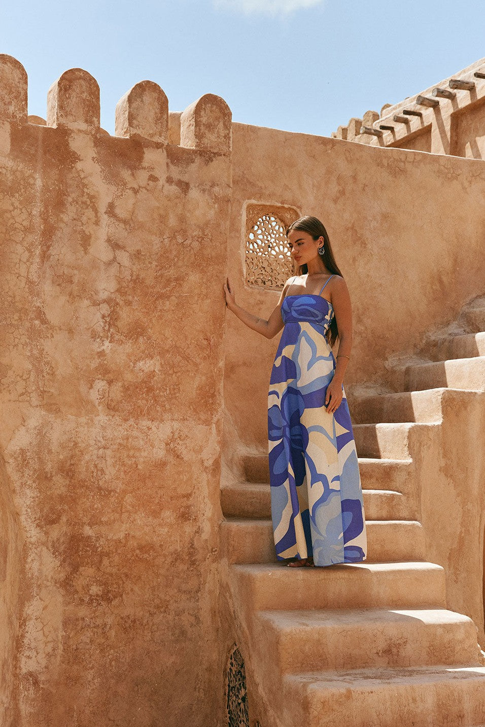 Blue maxi dress with an A-line skirt, side view