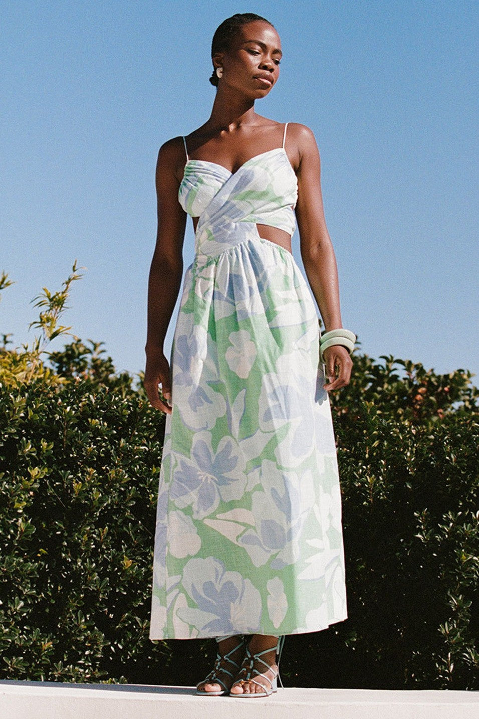 Blue midi dress with an open back, front view