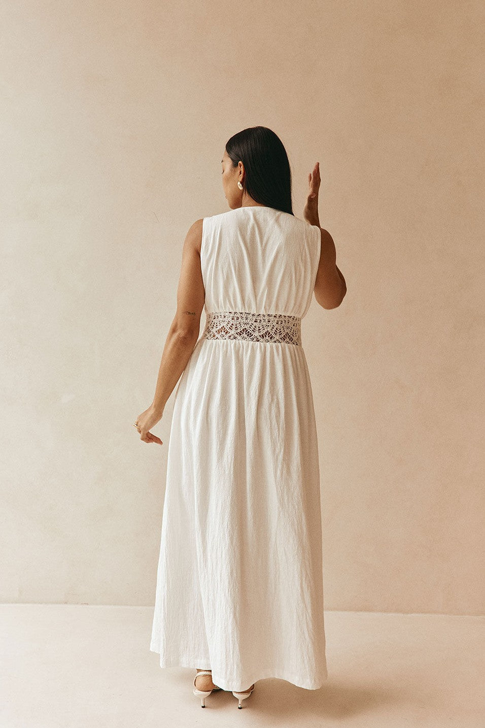 White maxi dress with a strapless neckline, back view