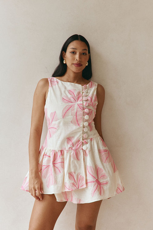 Pink mini dress with a wrap silhouette, back view
