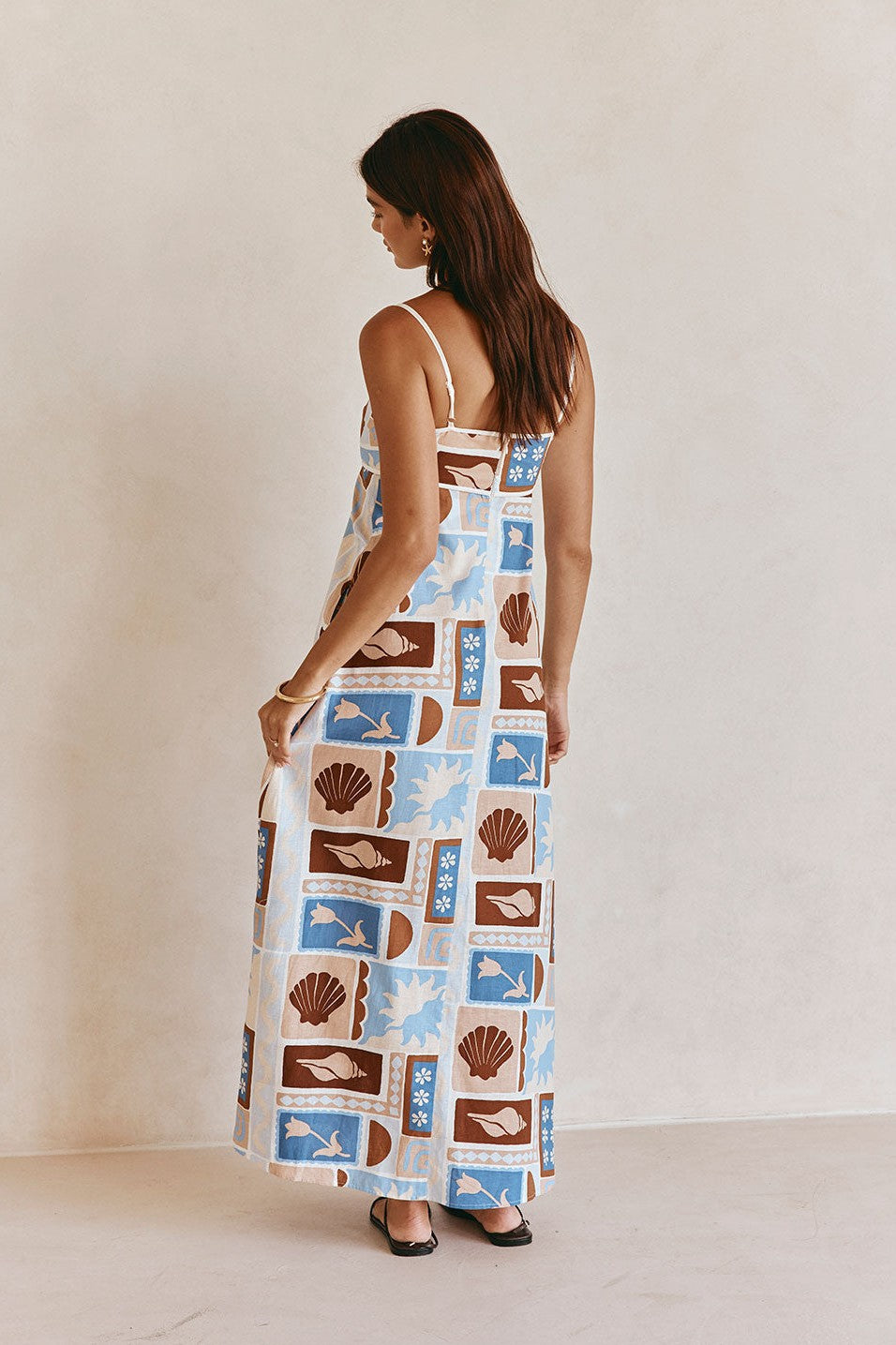 Blue maxi dress with an A-line skirt, styled on model
