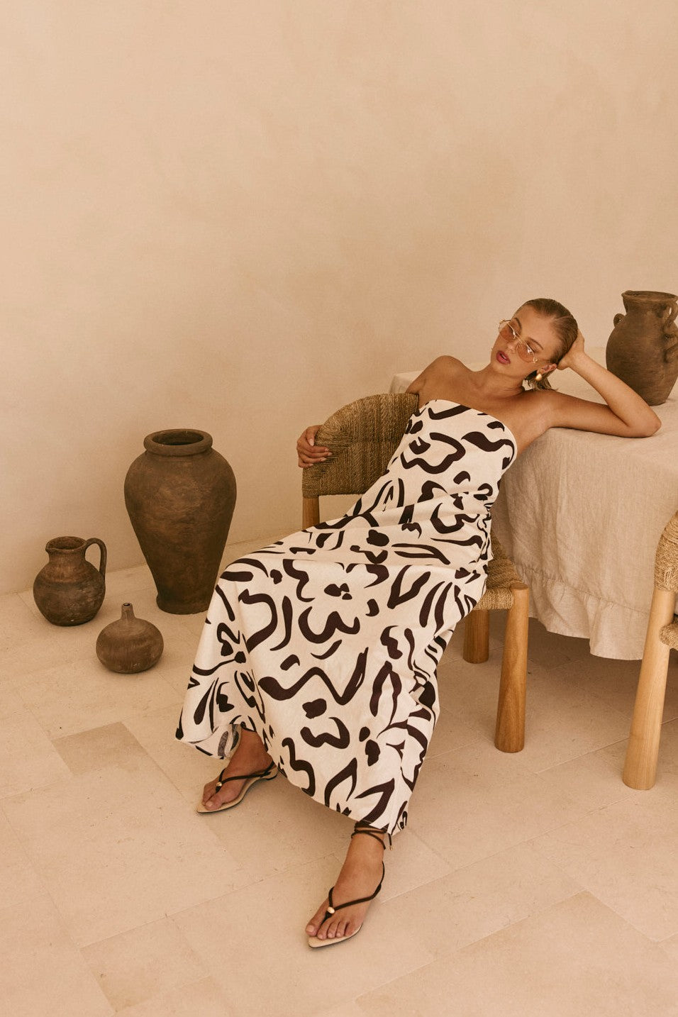 Cream maxi dress with a strapless neckline, front view