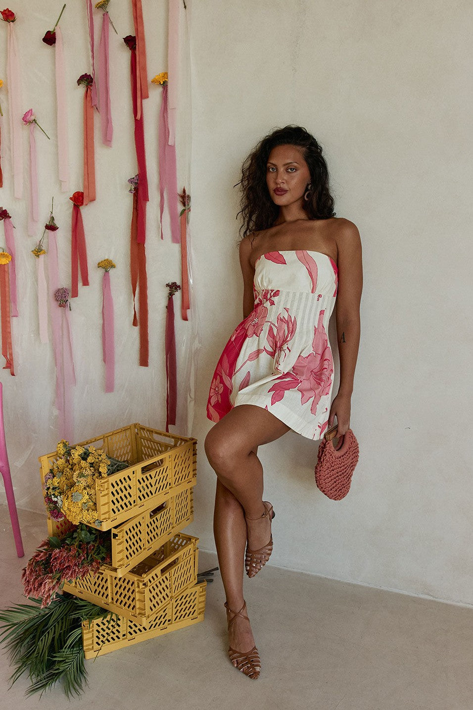 Pink mini dress with a strapless neckline, back view