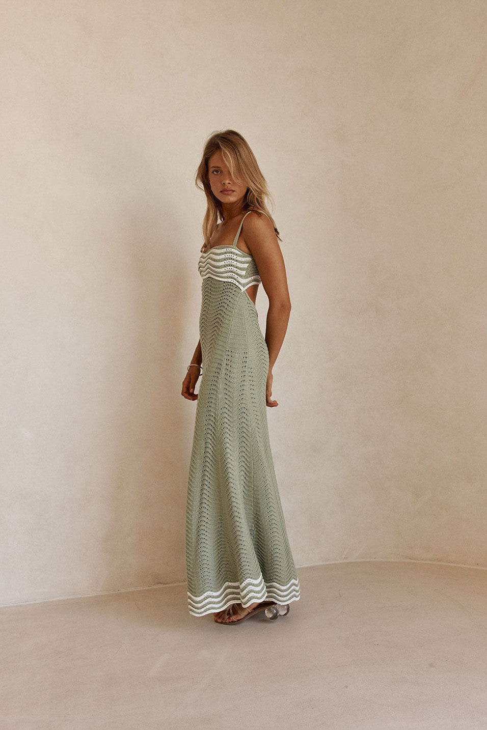Green maxi dress with a round neckline, side view