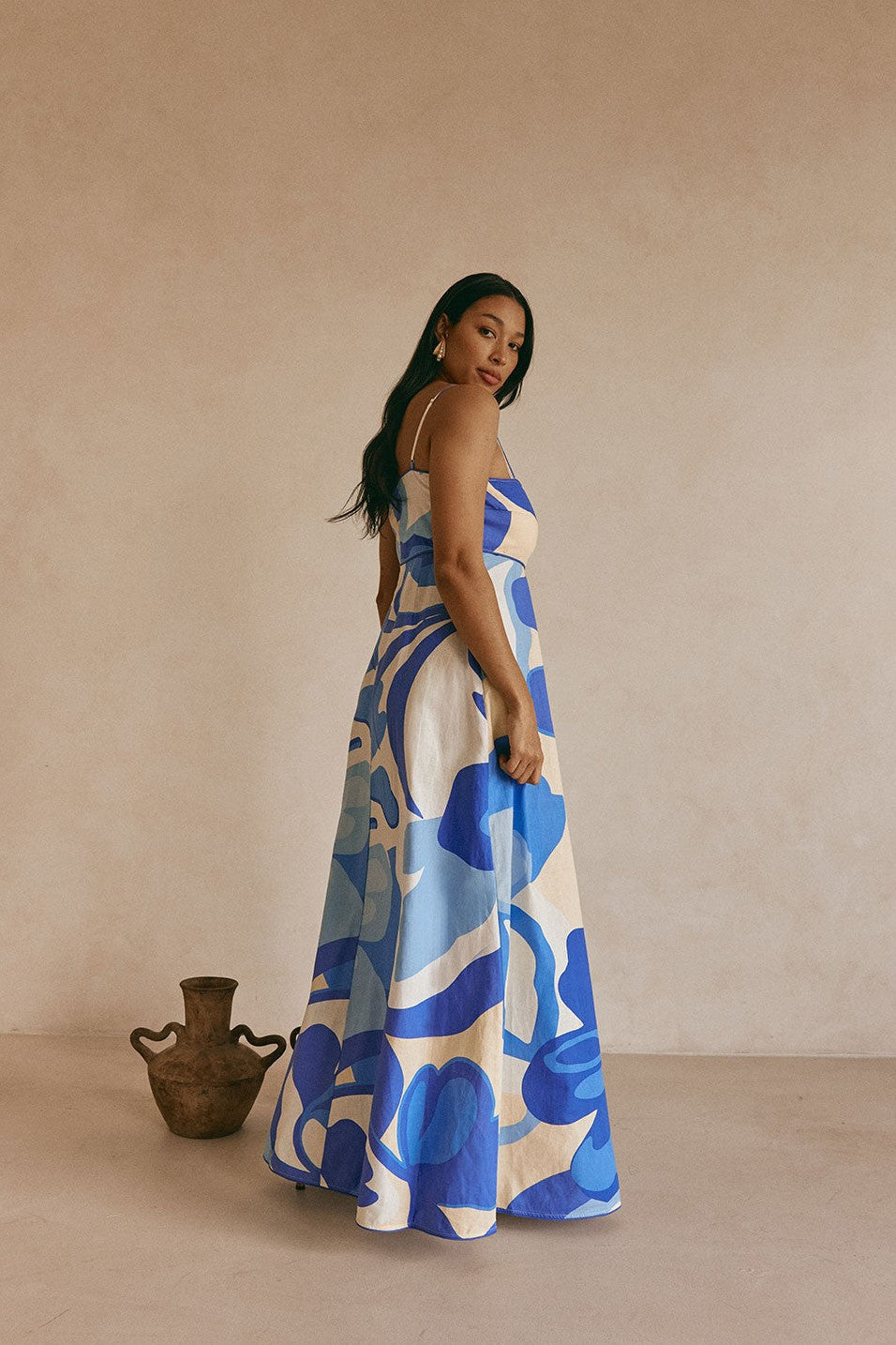 Blue maxi dress with an A-line skirt, back view