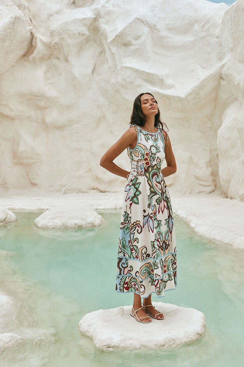 Blue maxi dress with a boat neckline, side view
