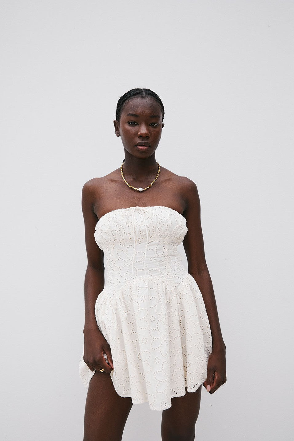 Beige mini dress with a strapless neckline, front view