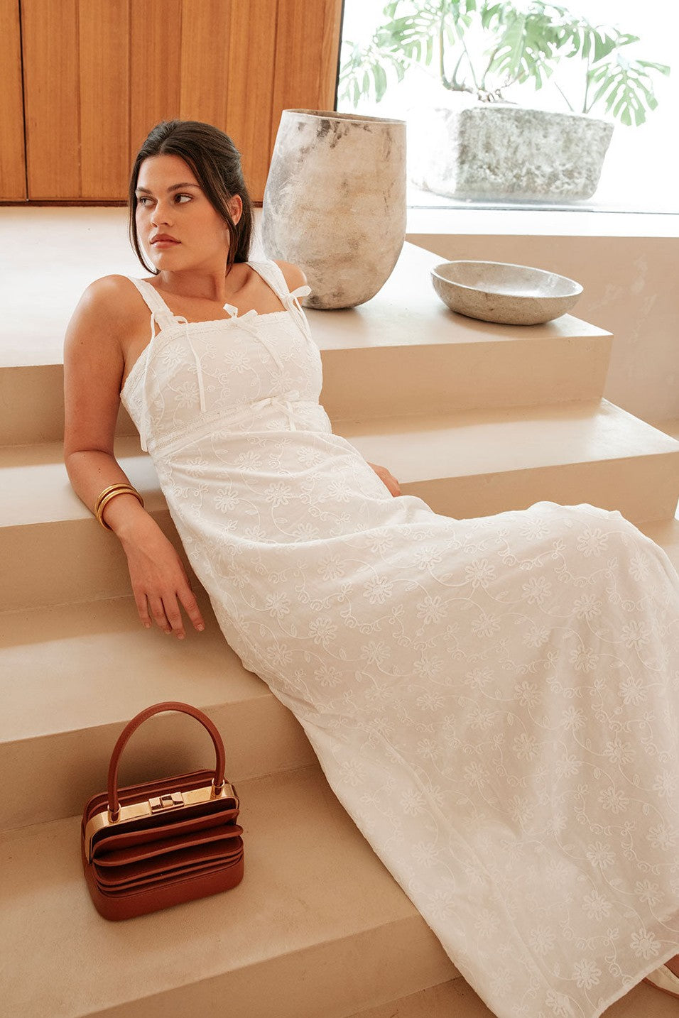 White maxi dress with an A-line skirt, back view