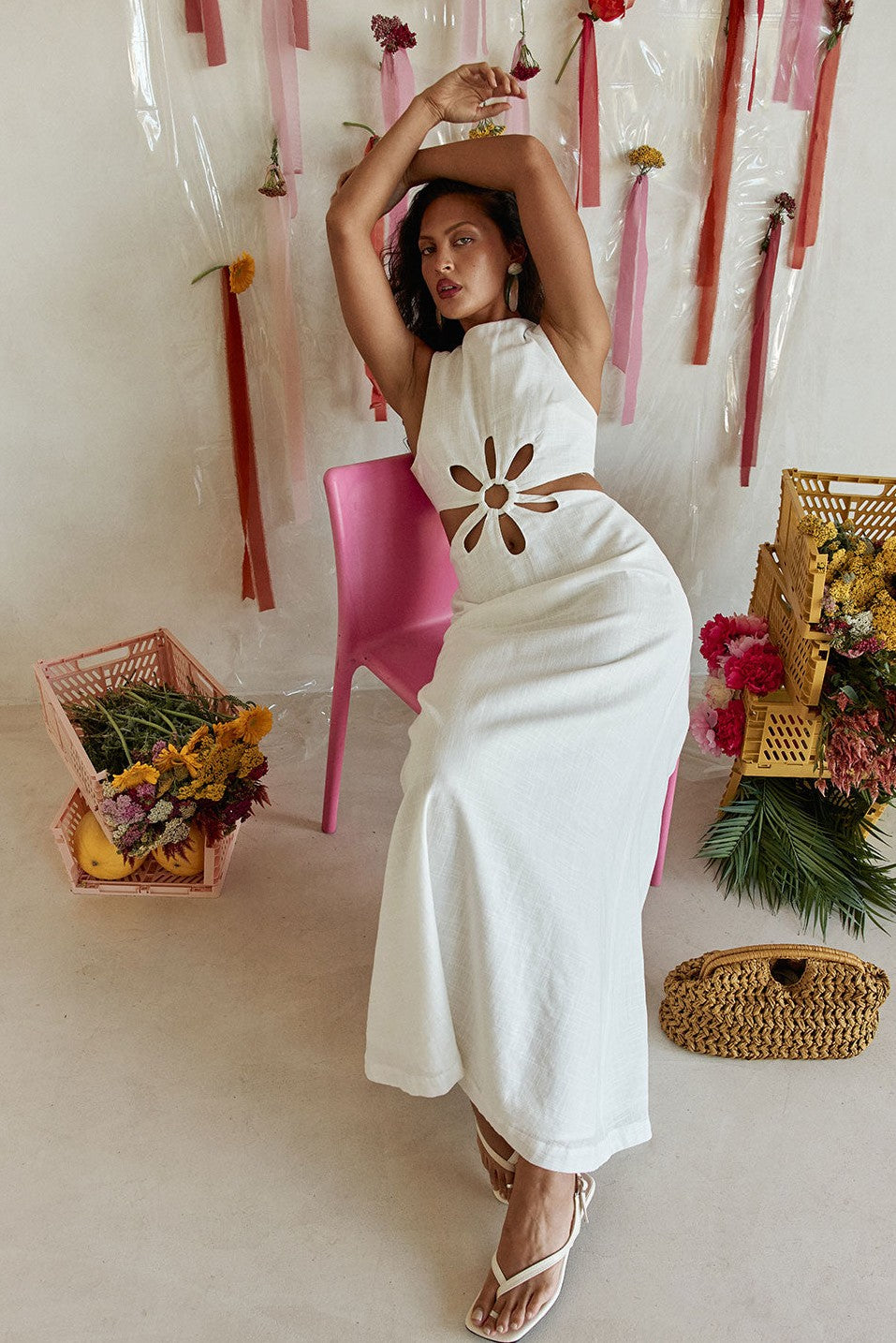 White maxi dress with a sleeveless bodice, styled on model