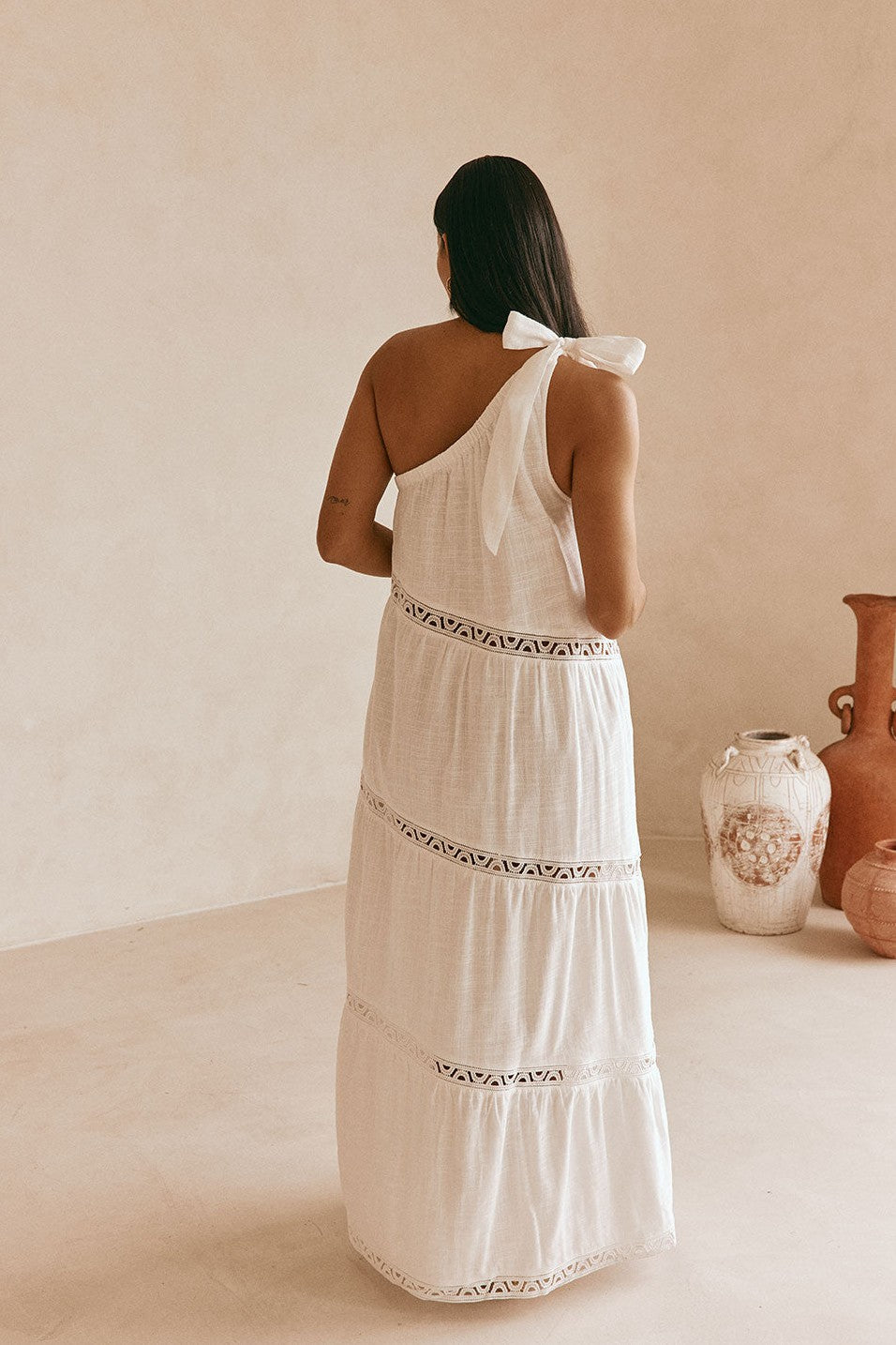 White maxi dress with lace trim, back view