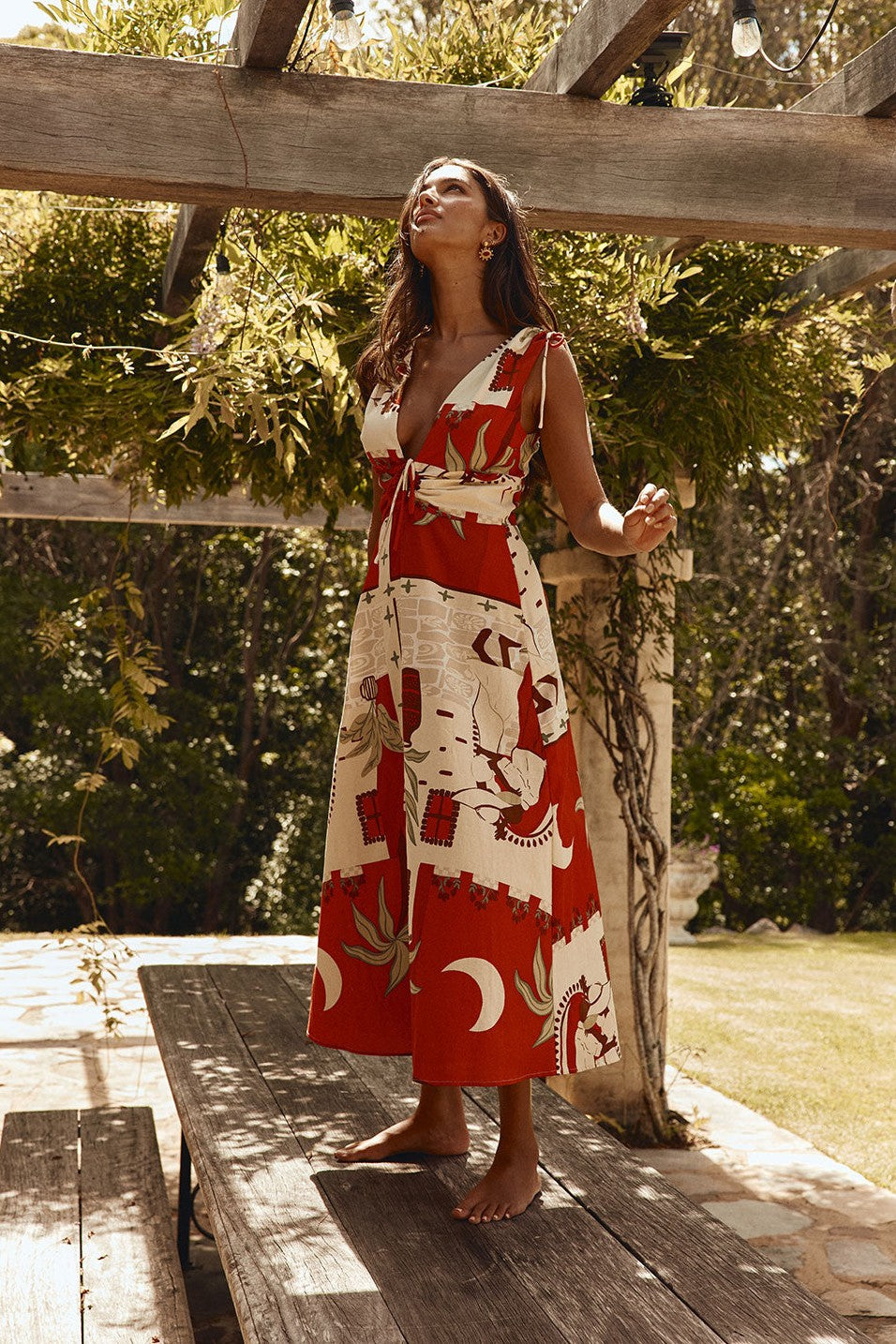 Red maxi dress with a V neckline, side view