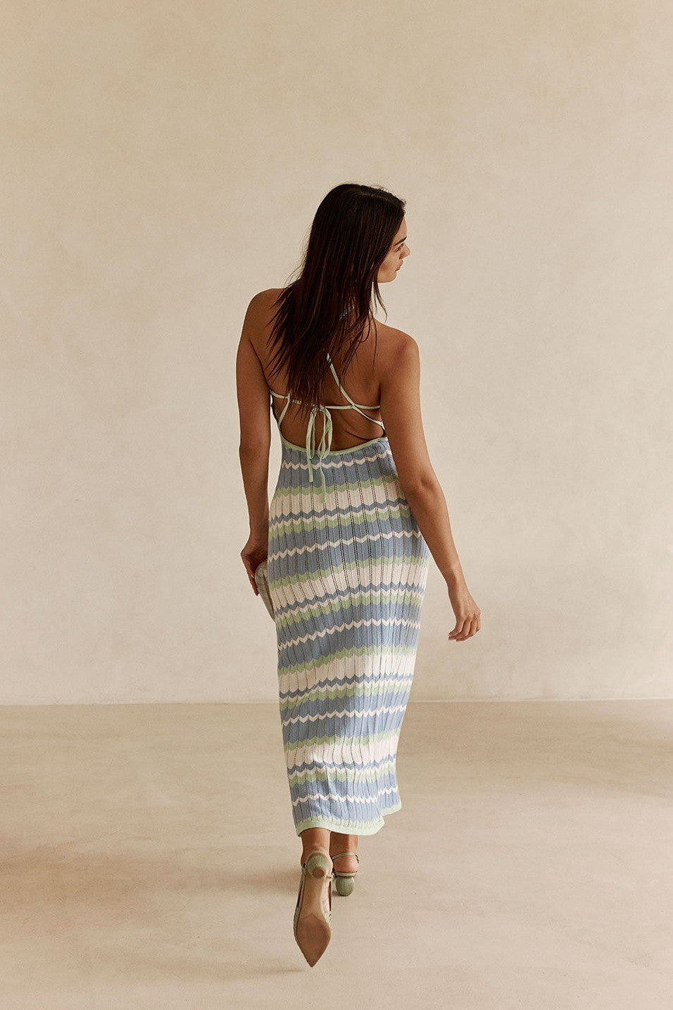 Blue maxi dress with a halter neckline, styled on model
