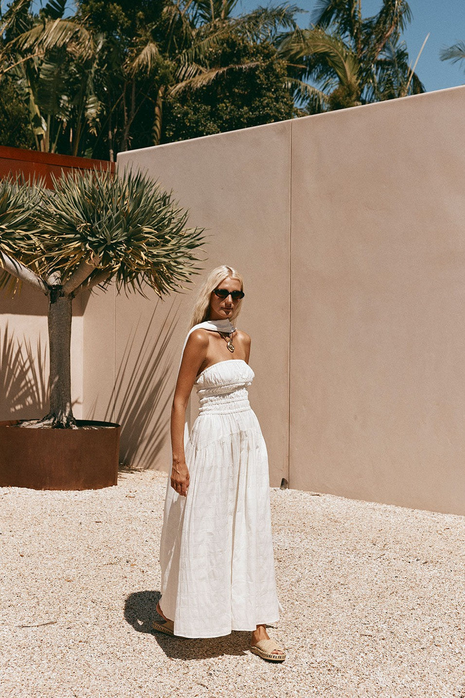 White maxi dress with a strapless neckline, back view
