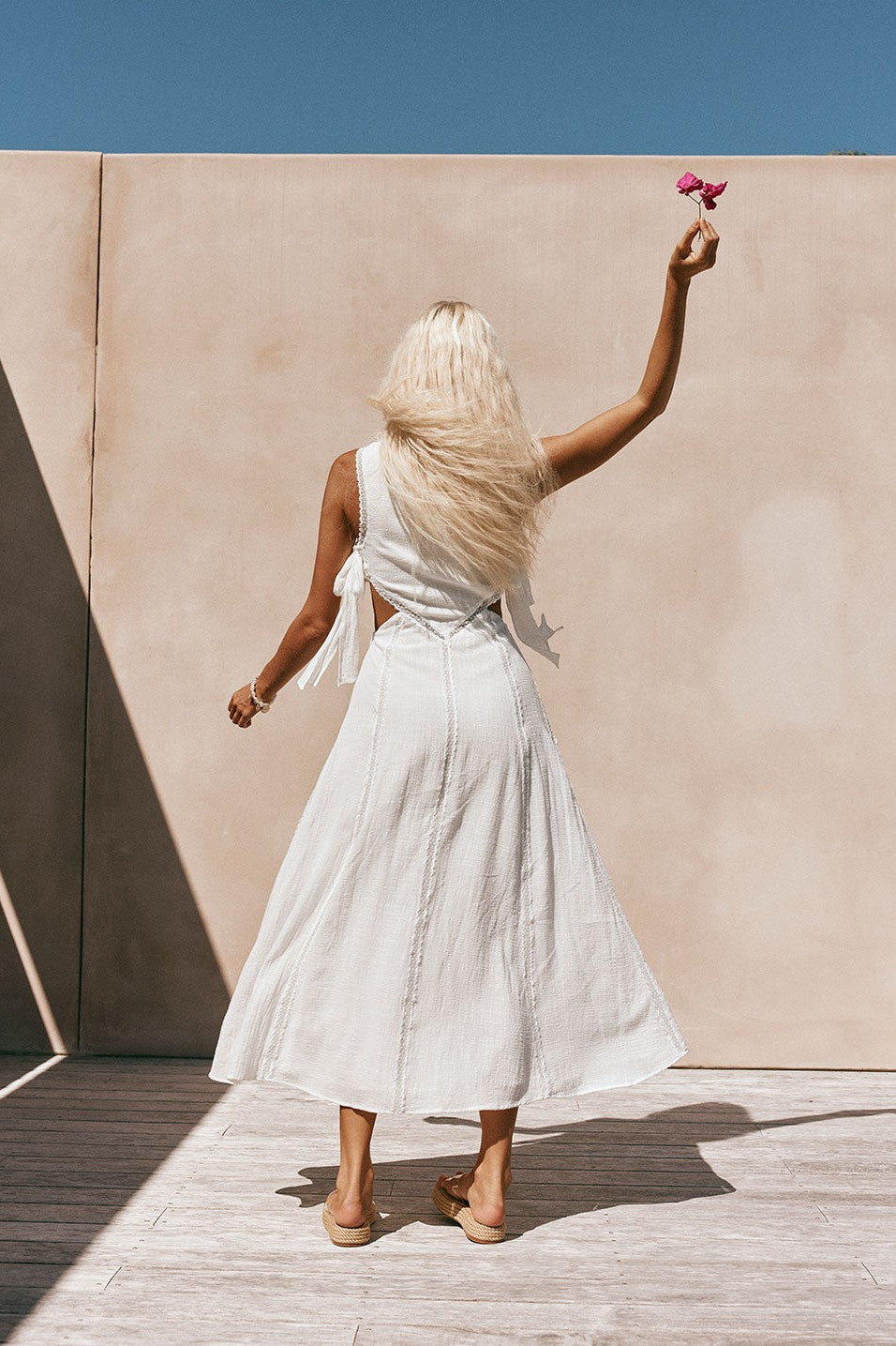 White maxi dress with an A-line skirt, detail view