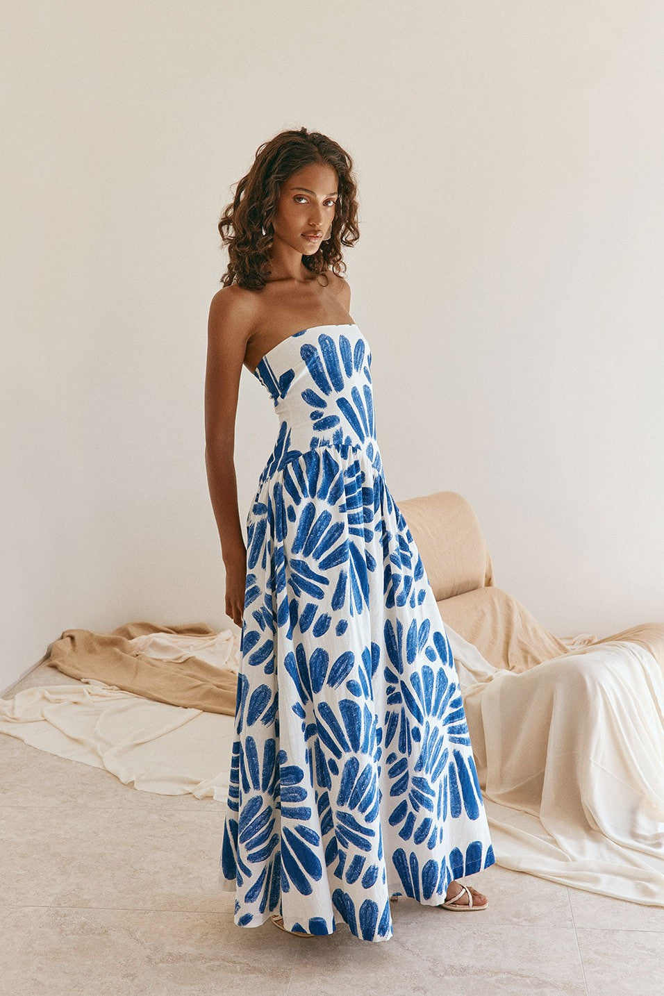 Blue maxi dress with a strapless neckline, side view
