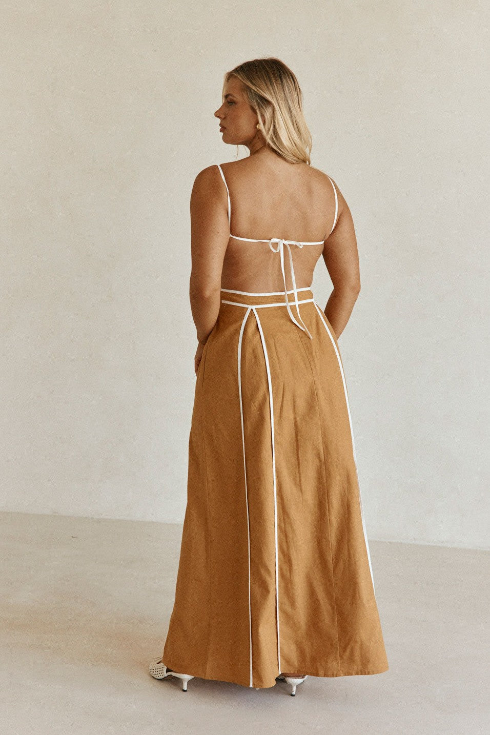Tan maxi dress with an open back, front view
