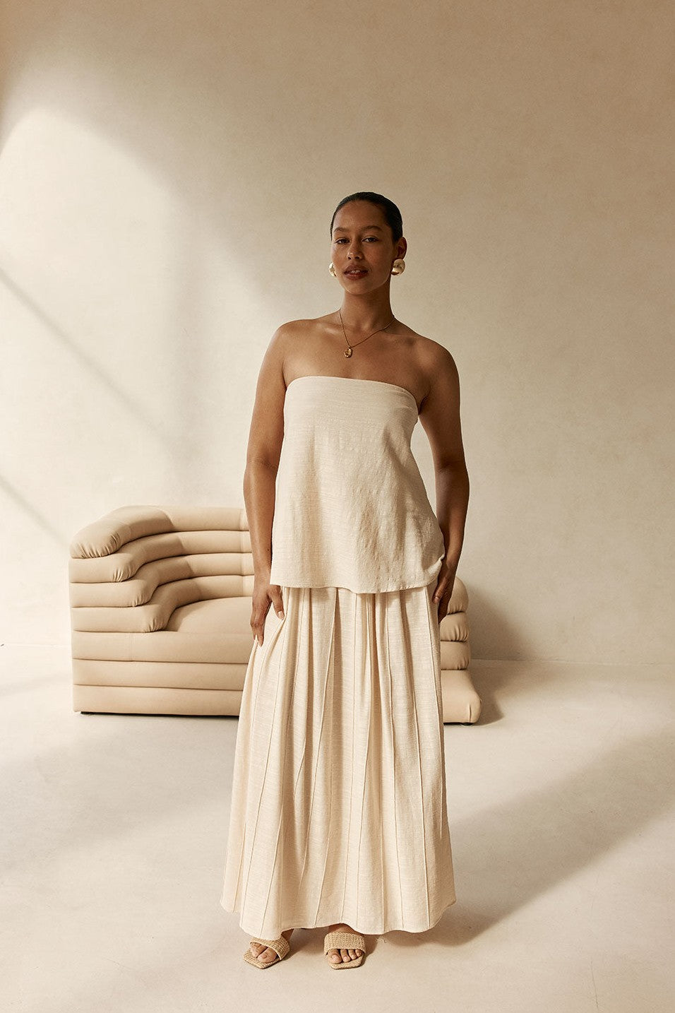 Beige maxi dress with a strapless neckline, back view