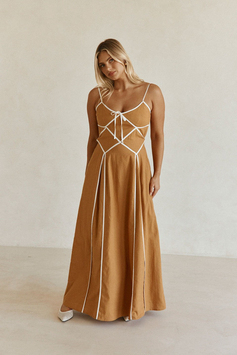 Tan maxi dress with an open back, back view