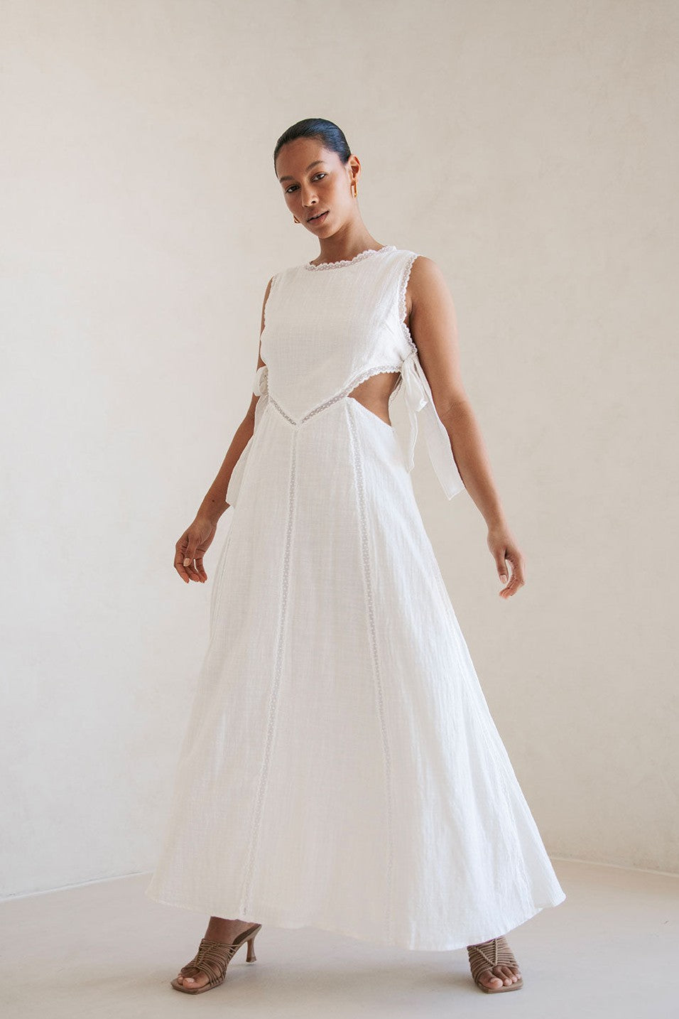 White maxi dress with an A-line skirt, styled on model