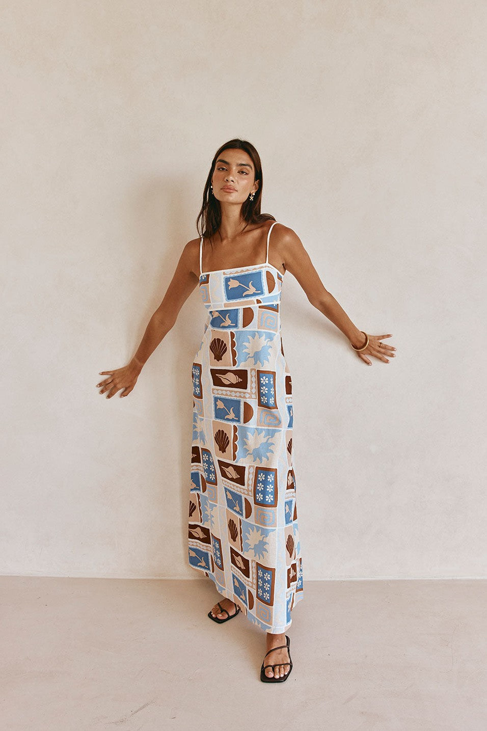 Blue maxi dress with an A-line skirt, side view