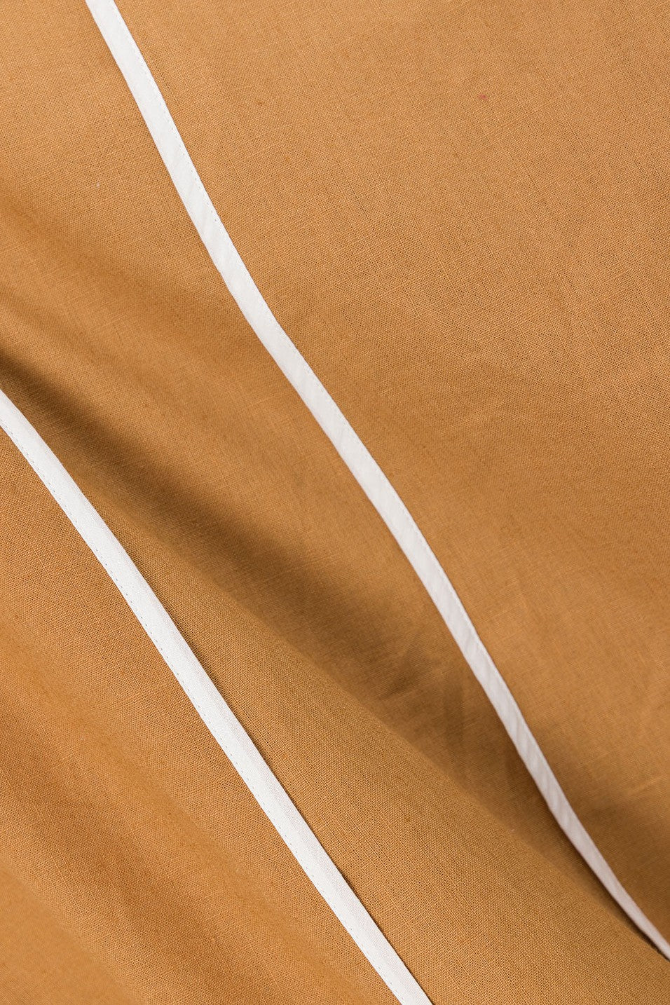 Tan maxi dress with an open back, side view