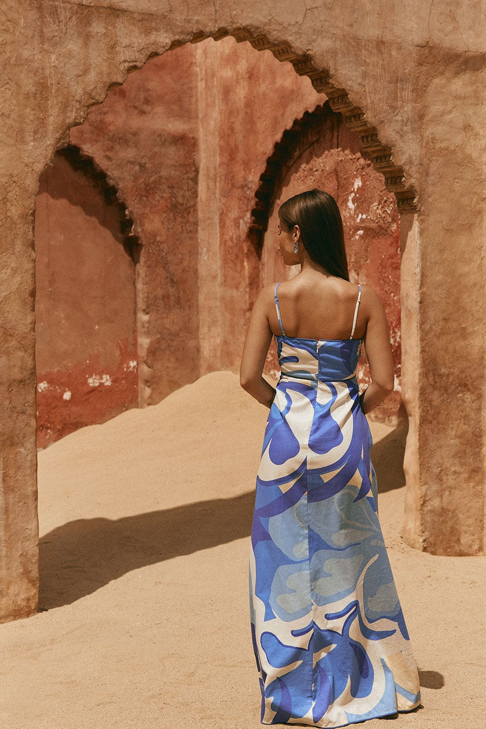 Blue maxi dress with an A-line skirt, styled on model
