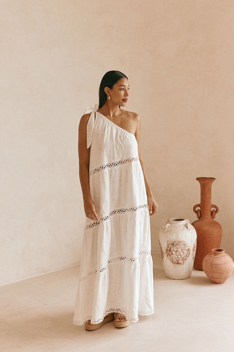White maxi dress with lace trim, styled on model