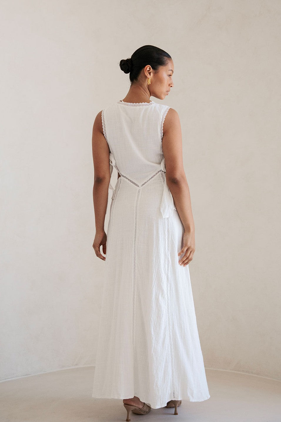 White maxi dress with an A-line skirt, back view