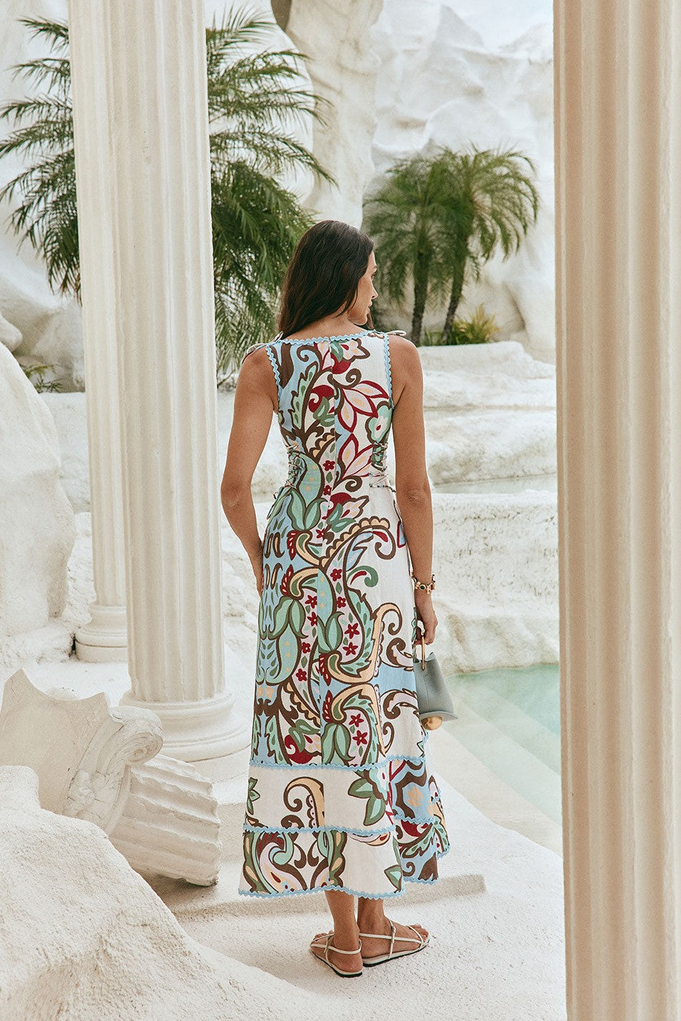 Blue maxi dress with a boat neckline, styled on model