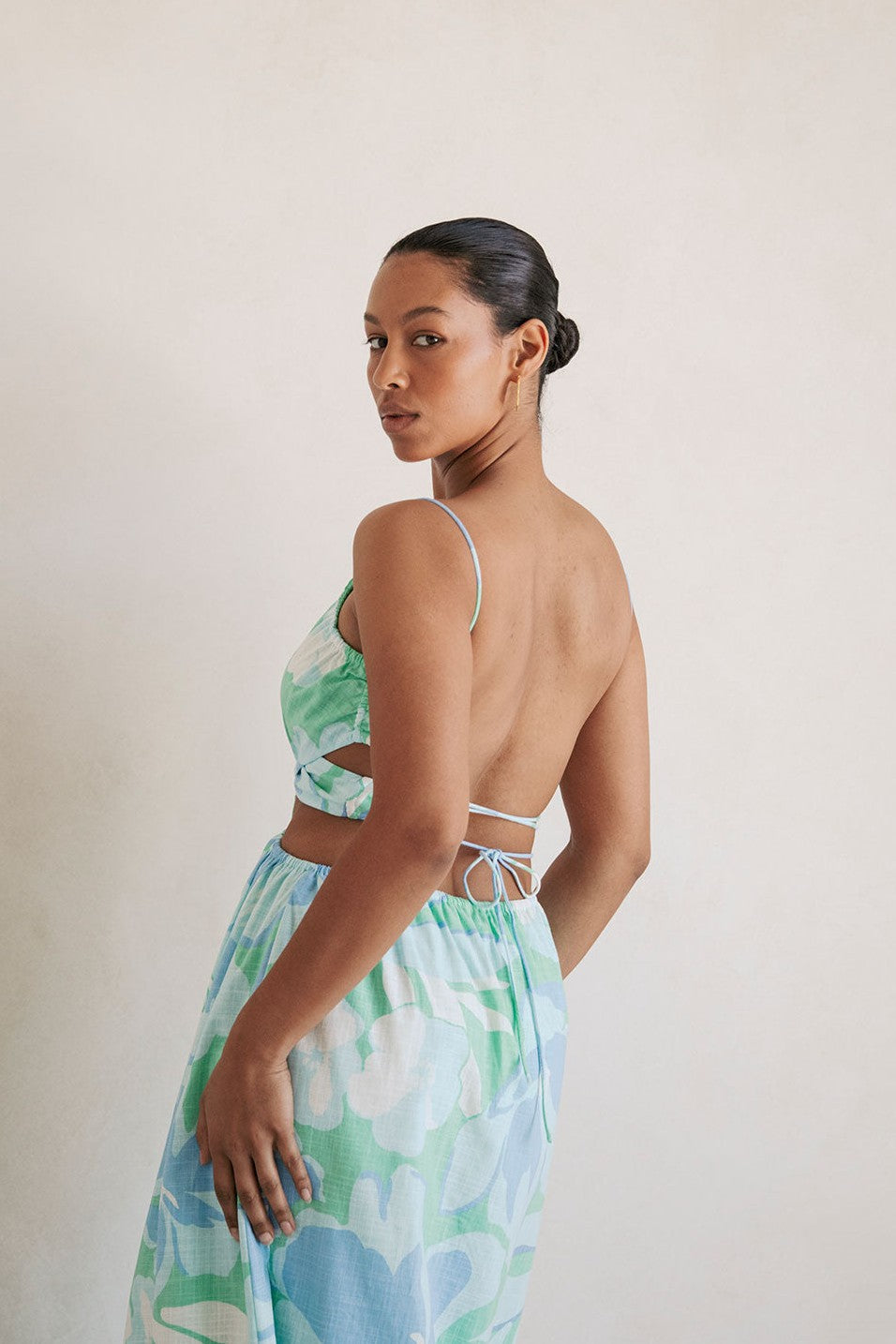 Blue midi dress with an open back, side view