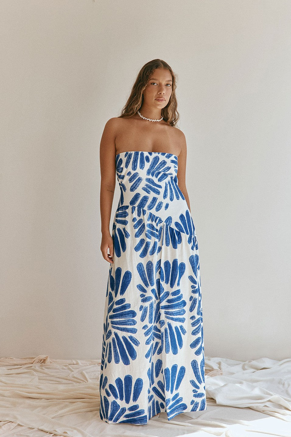 Blue maxi dress with a strapless neckline, back view