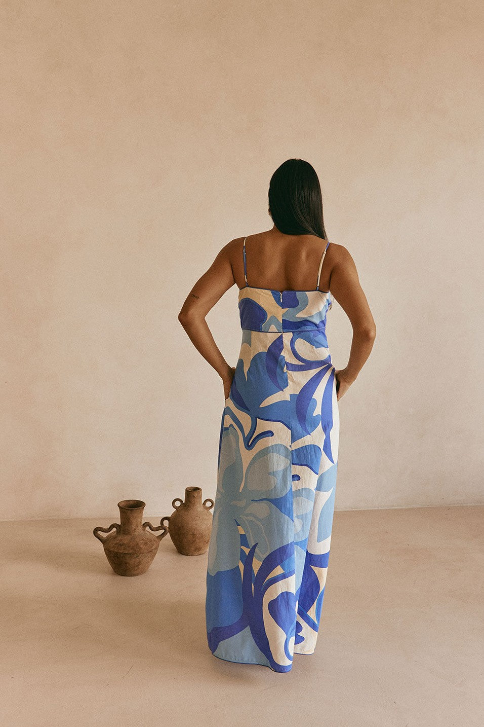 Blue maxi dress with an A-line skirt, side view