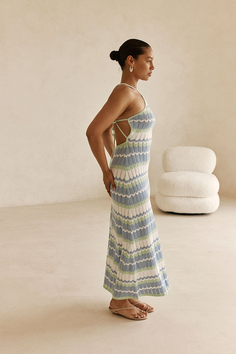Blue maxi dress with a halter neckline, back view