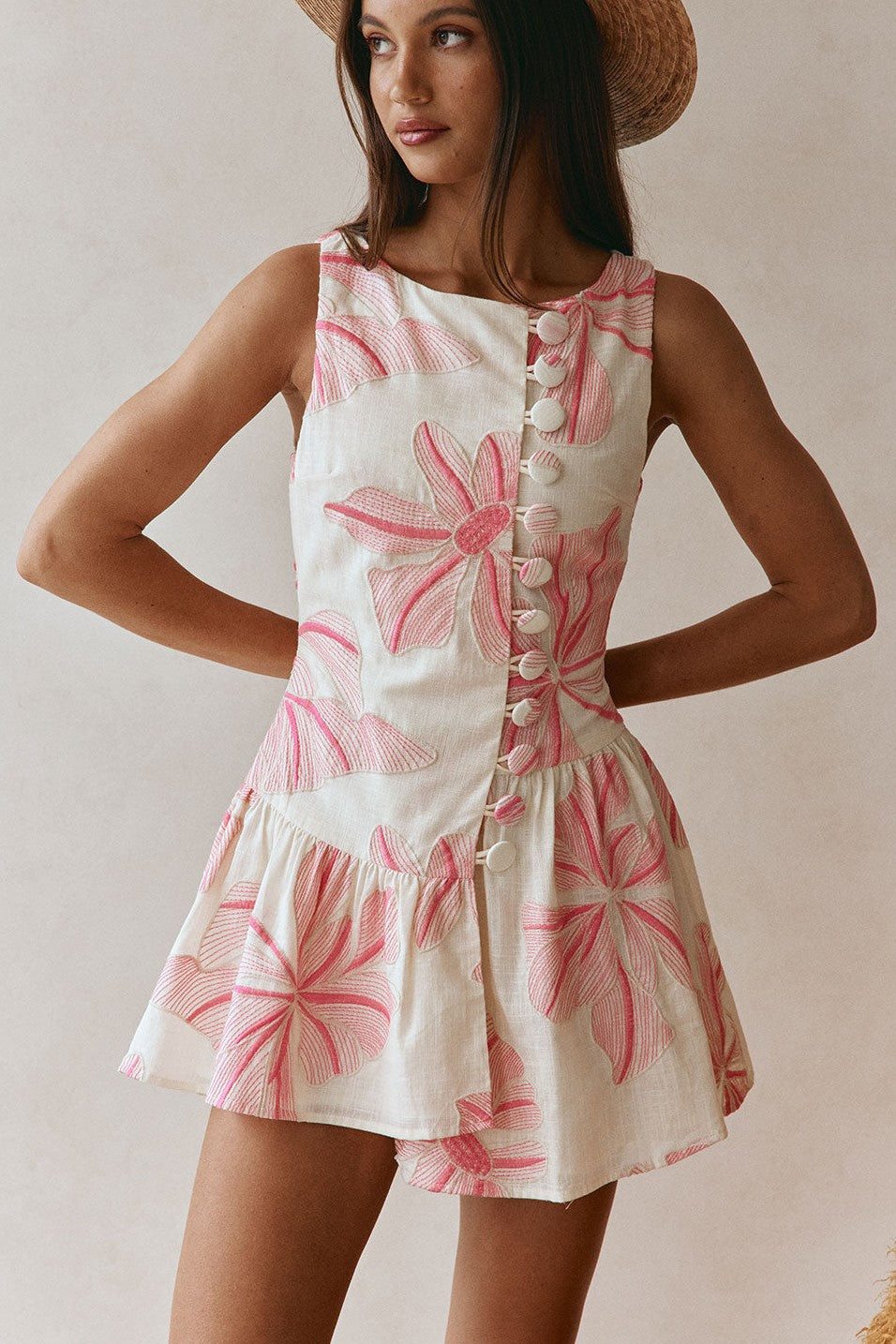 Pink mini dress with a wrap silhouette, front view