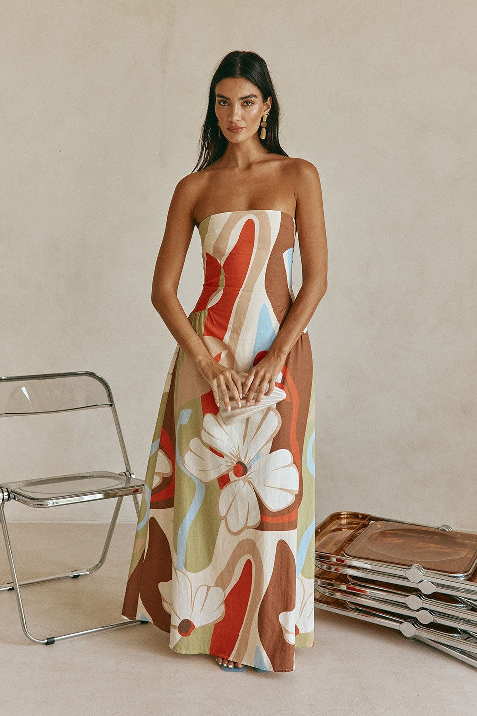 Orange maxi dress with a strapless neckline, side view