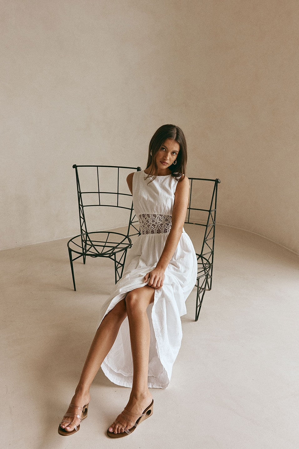 White maxi dress with a strapless neckline, side view