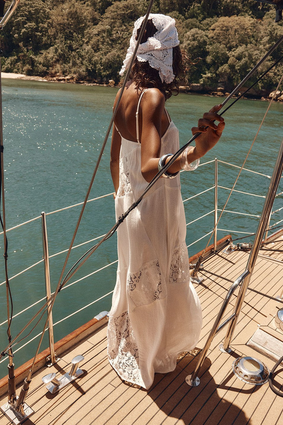 White maxi dress with lace trim, styled on model