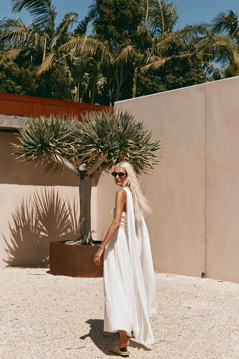 White maxi dress with a strapless neckline, detail view