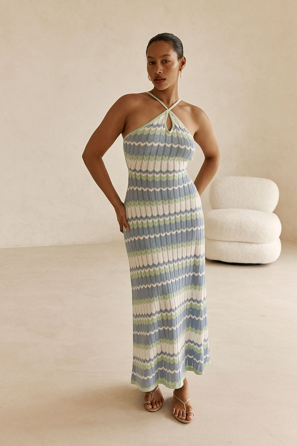 Blue maxi dress with a halter neckline, back view