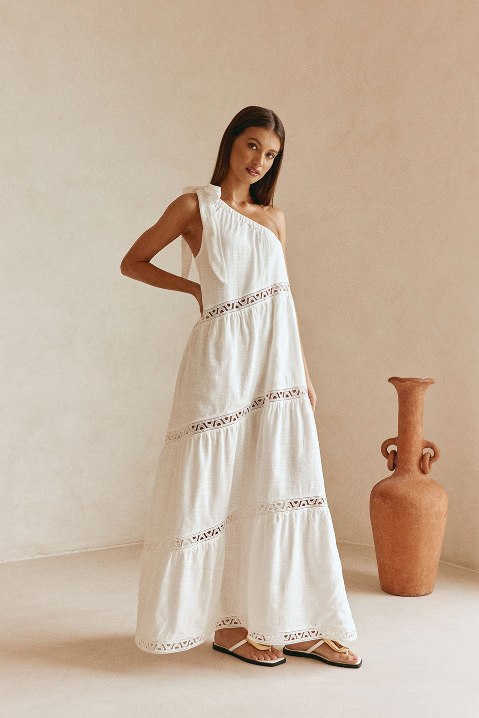 White maxi dress with lace trim, side view