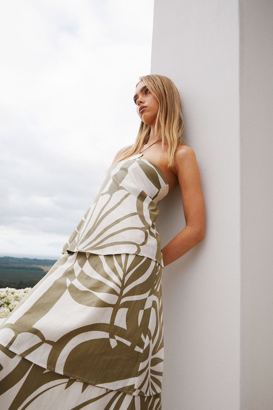Green maxi dress with a strapless neckline, detail view