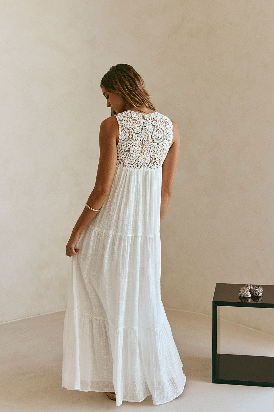 White maxi dress with a V neckline, detail view