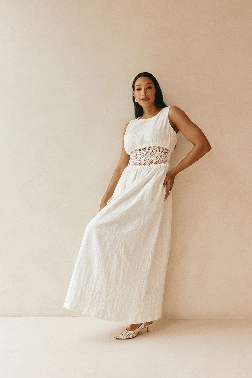 White maxi dress with a strapless neckline, styled on model